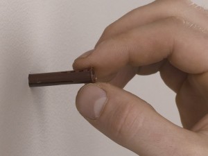 inserting wall plug into masonry or solid wall