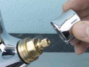 Revealing tap valve after removing shroud.