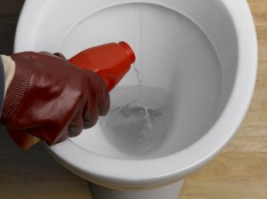 Using chemical cleaner to unblock toilet