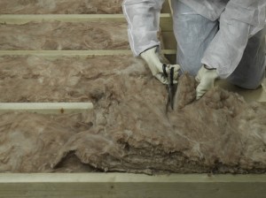 trimming lengths of loft insulation
