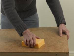 wiping pasting table to remove wallpaper paste