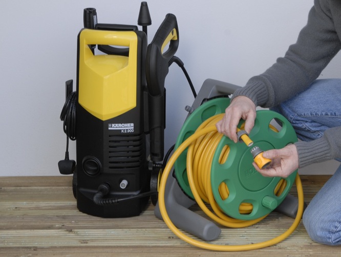 pressure washer and hose for cleaning deck