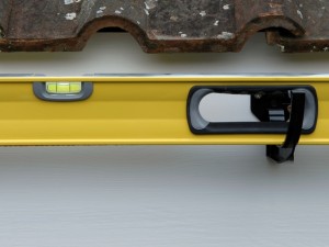 Using spirit level to maintain gutter gradient