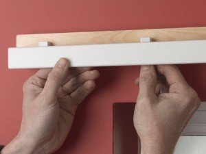 Clipping curtain track onto brackets