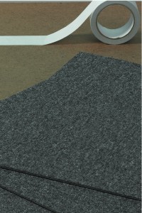 Laying vinyl tiles or carpet tiles