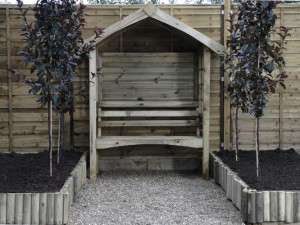 Arbour against fence