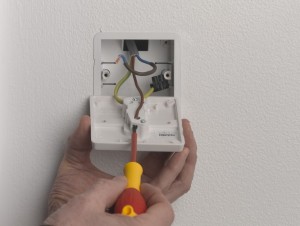Unscrew light switch terminal screws